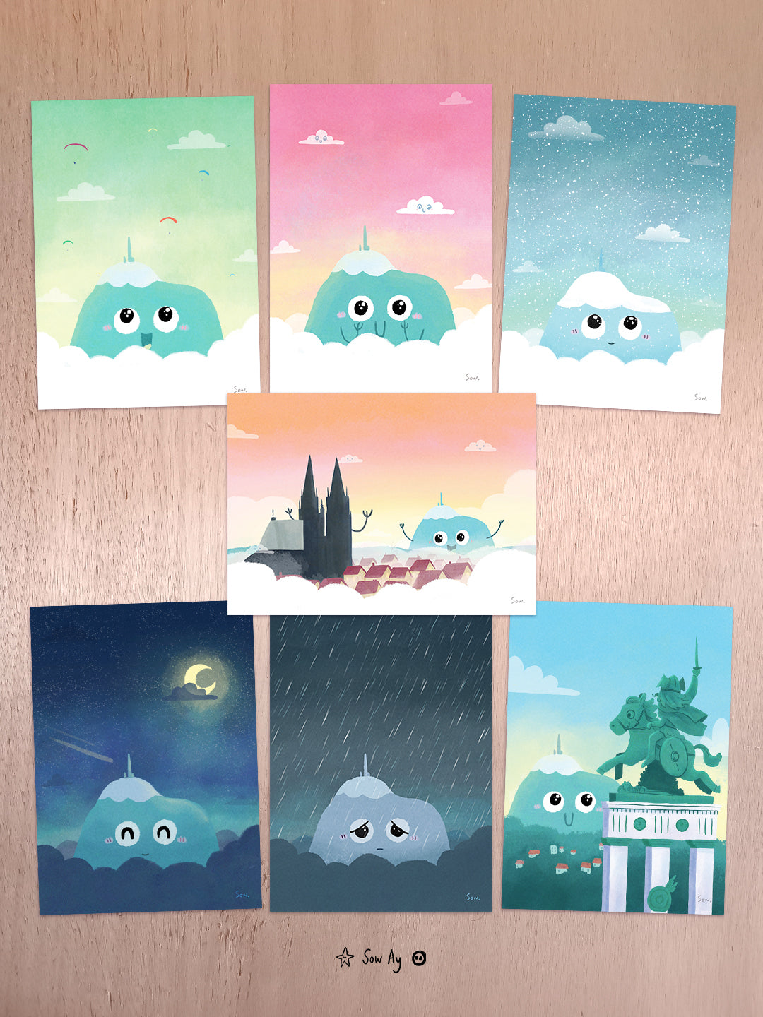 assortiments de 7 illustrations du puy de dome humanisé et mignon : un avec des parapentes de jour, un heureux avec ciel rose, un regardant la neige tomber sur lui, un de nuit avec ciel étoilé, un triste sous la pluie, un heureux au loin regardant la statue de vercingétorix, et un de lui faisant coucou à la cathédrale de clermont ferrand.