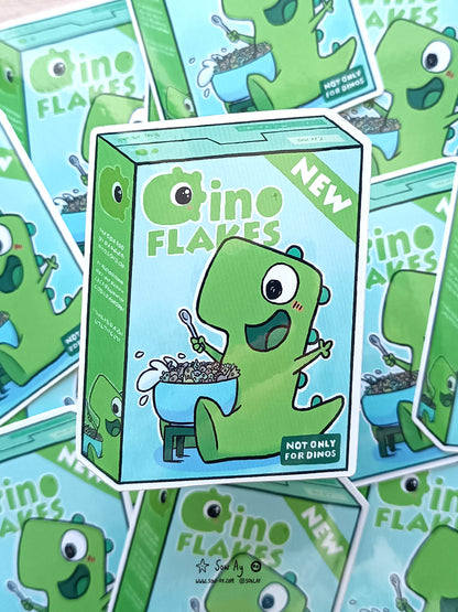 boîte de céréales sur laquelle on voit un dinosaure vert très heureux de manger ses céréales en forme de petits dinosaures