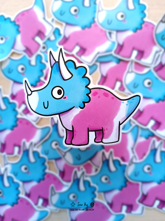 tricératops aux couleurs du drapeau transgenre rose blanc et bleu